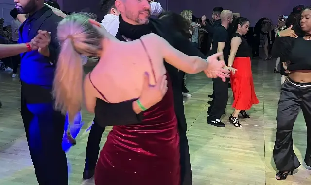 Energetic salsa couple dancing on stage video thumbnail